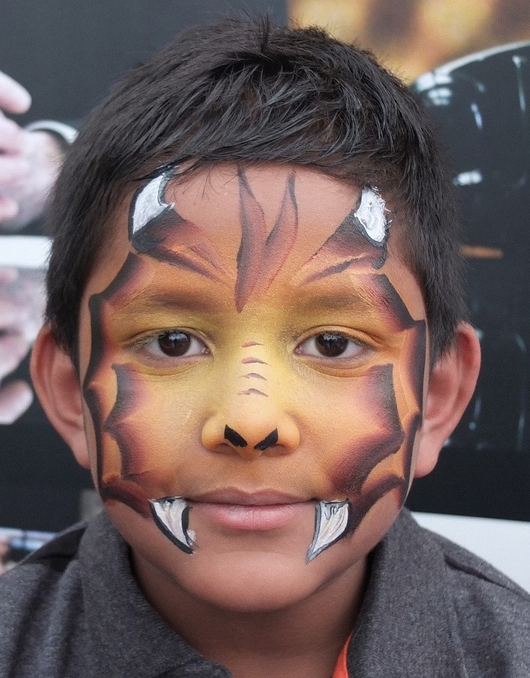 boy with dragon face paint