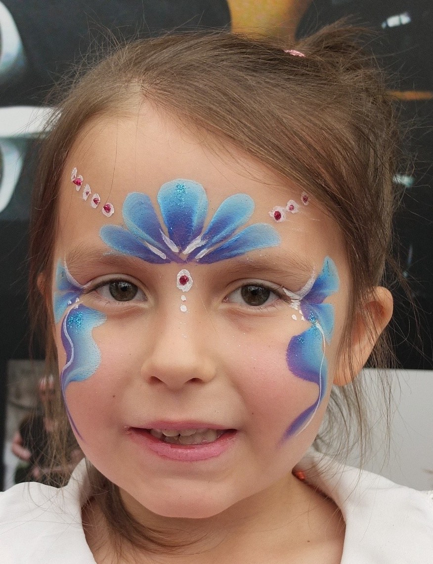 girl with fairy face paint
