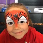 girl with spiderman face paint