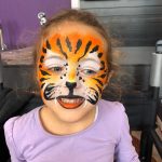 girl with tiger face paint